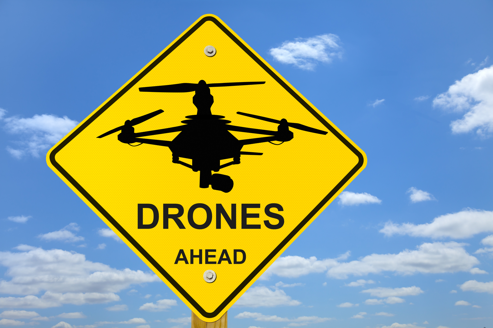 Drones Ahead Road Sign; symbolic of the near future, which will have more drones and more drone-issues. This image is useful for any drone related topic.
